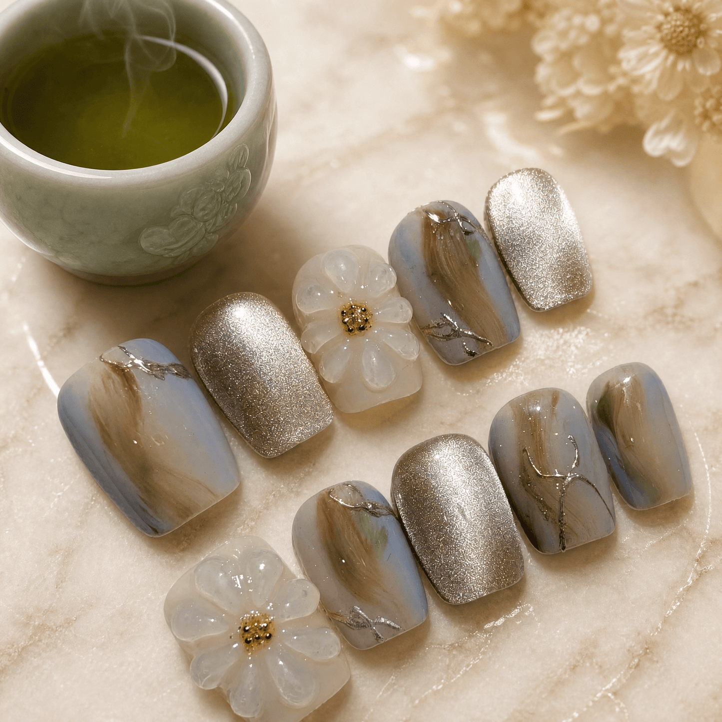 Calm Storm handmade press on nails in green and gold with 3D floral design. 