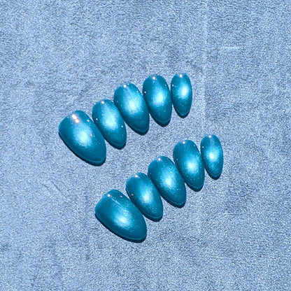 Salon quality teal blue cat eye press on nails in short almond