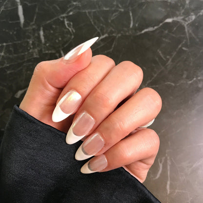 Hand with luxury French press-on nails with Chrome base 