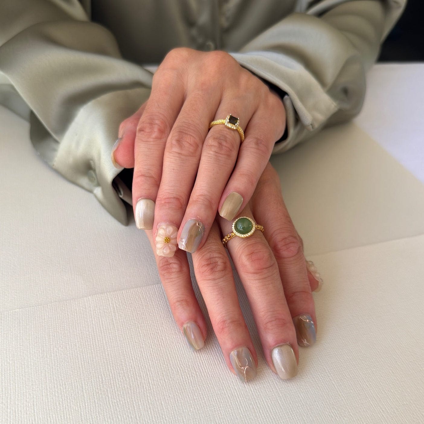 Calm Storm luxury handmade green and beige press-on nails with a 3d floral design in short square
