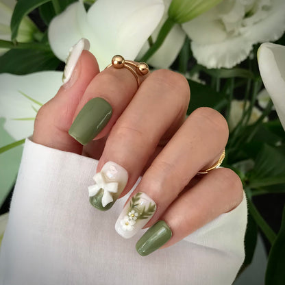Calm Storm premium press-on nails in green and white with 3D floral designs in medium square.