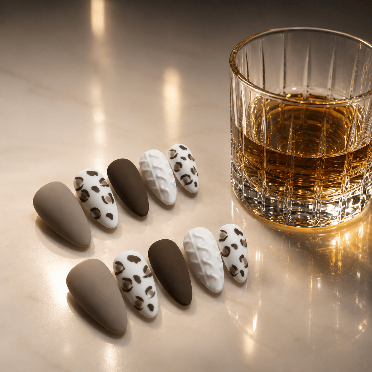 Calm Storm premium handmade press-on nails in leopard print design with a matt finish in almond shape.