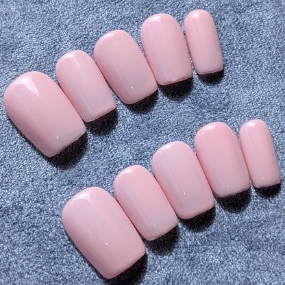 Handmade pale pink press-on nails in short square.  