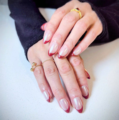 Calm Storm premium press-on nails with chrome base and red tip in short almond 