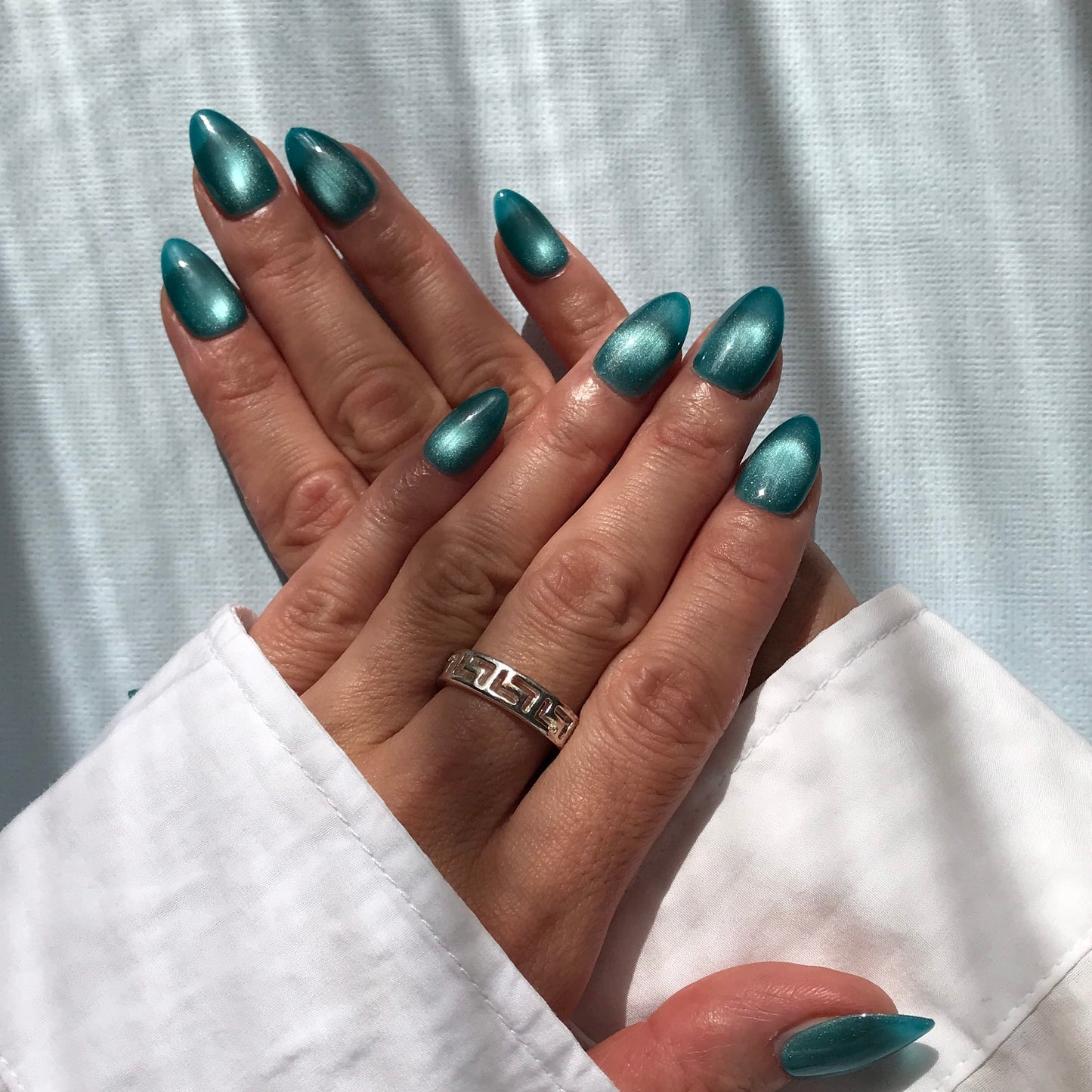Calm Storm premium handmade press-on nails in glittery ocean blue.