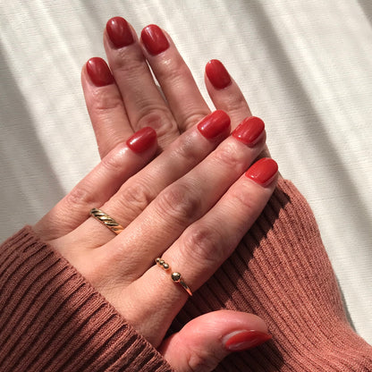 Calm Storm premium handmade press-on nails in warm red extra short. 