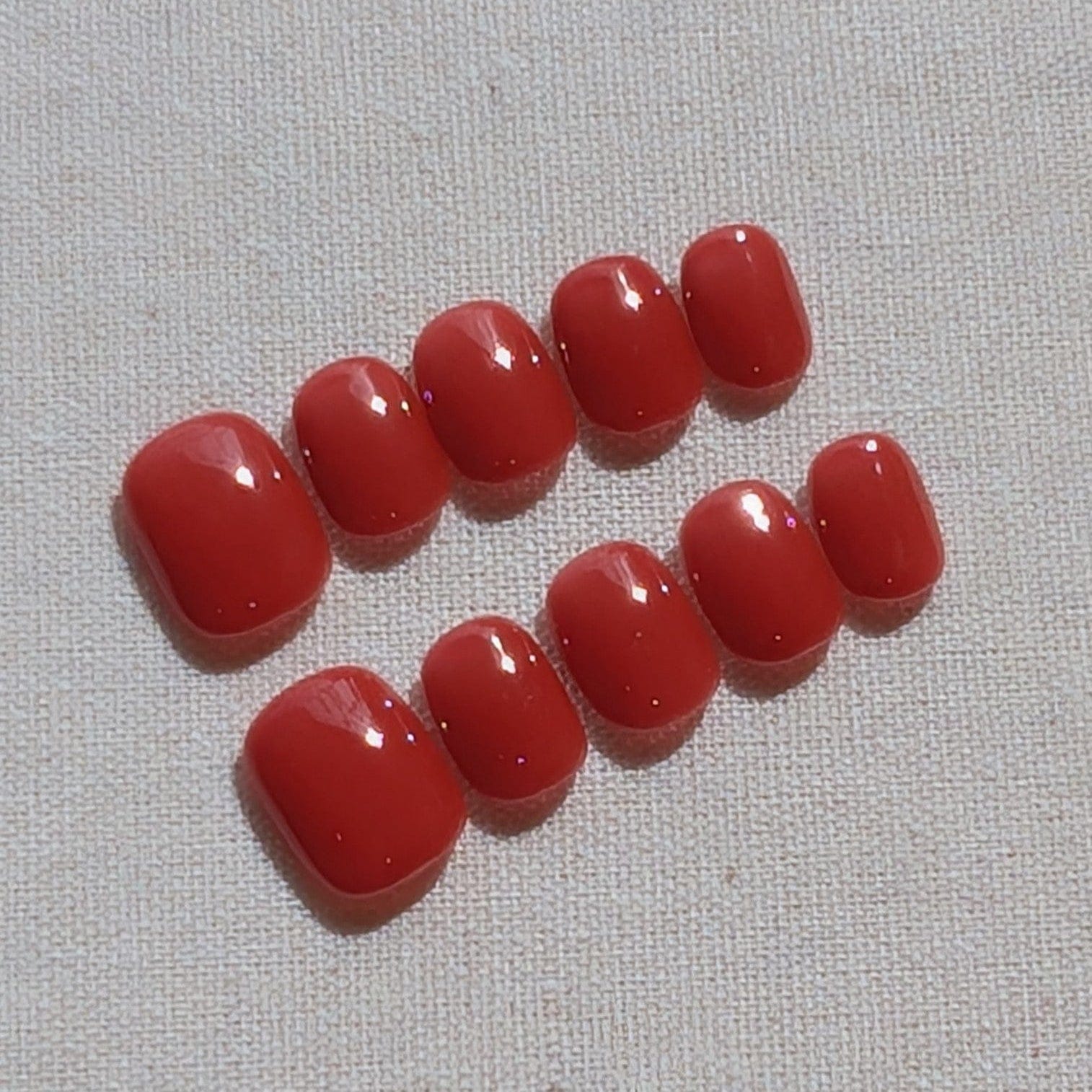 Calm Storm premium press-on nails in brick red in extra short round