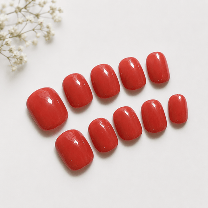 Calm Storm handmade press on nails in warm orange red in extra short. 