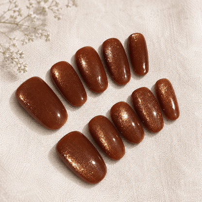 Calm Storm handmade press-on nails with a shimmering gold magnetic finish.