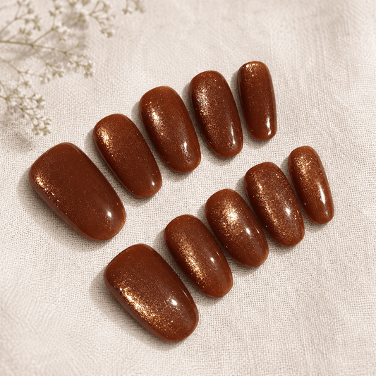 Calm Storm handmade press-on nails with a shimmering gold magnetic finish.