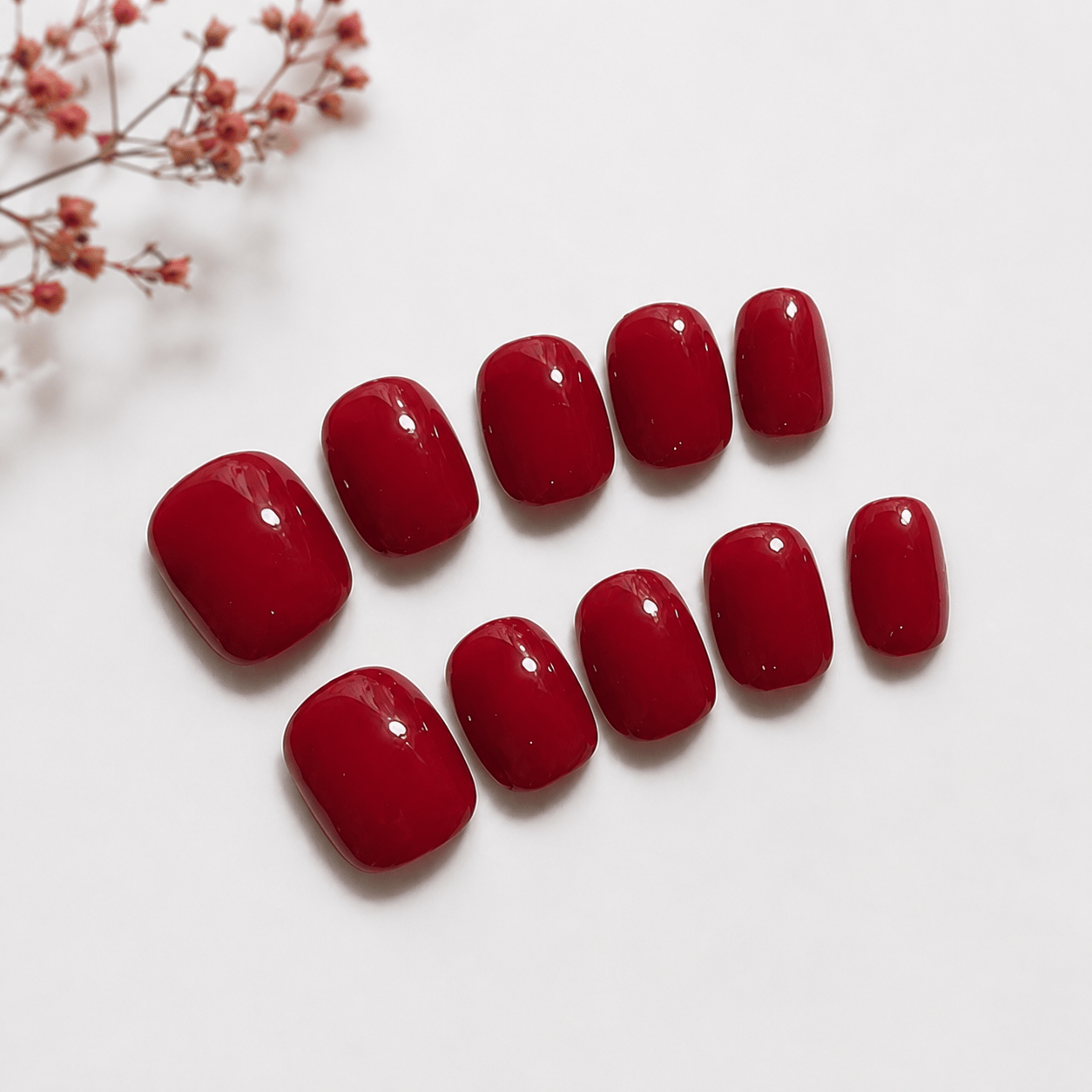 Calm Storm premium press on nails in classic red in extra short. 