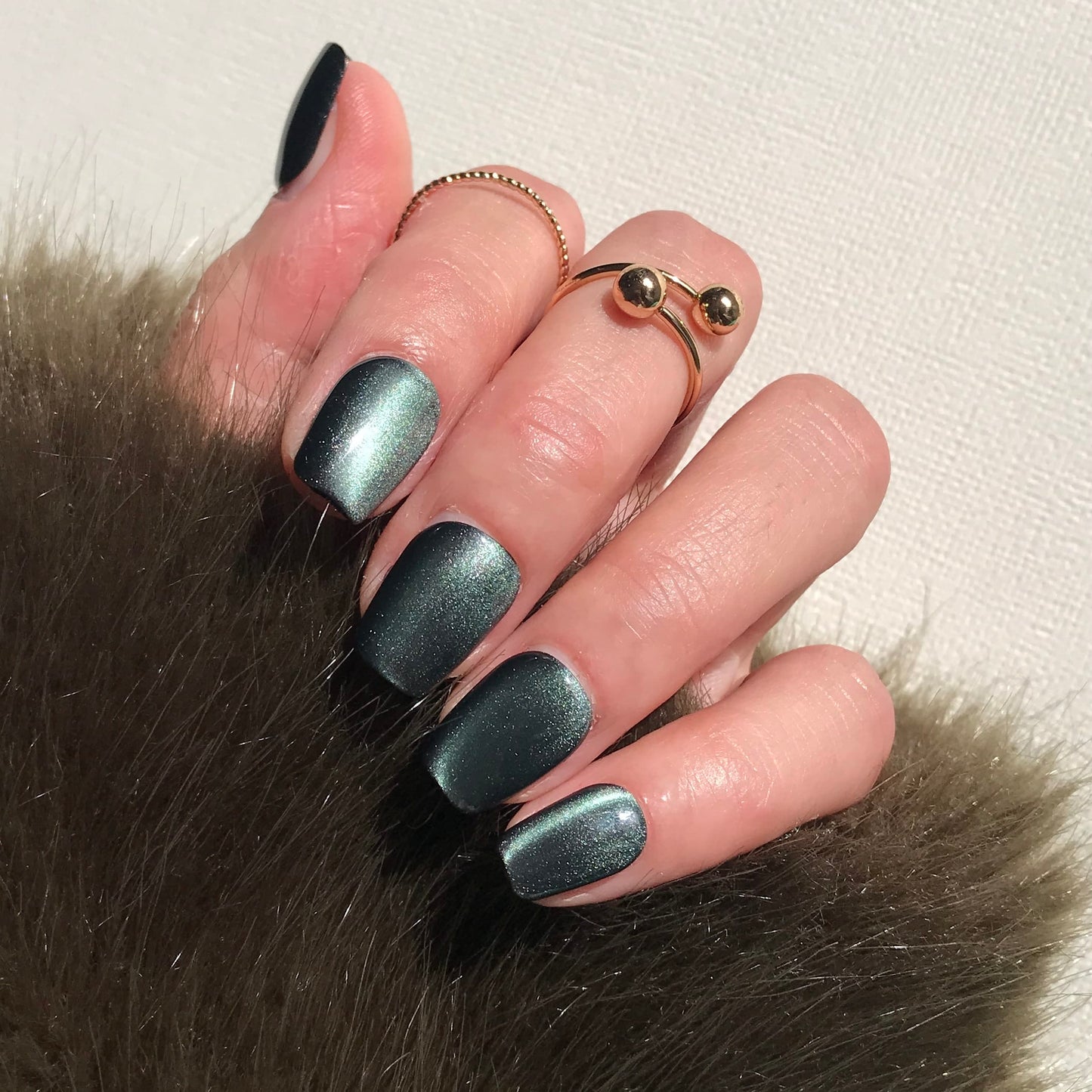 Calm Storm premium handmade press-on nails in emerald green cat eye effect. 