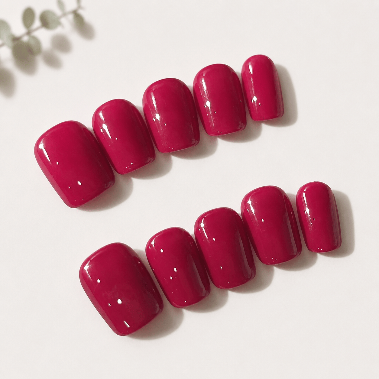 Calm Storm handmade press on nails in fuchsia pink in square shape. 
