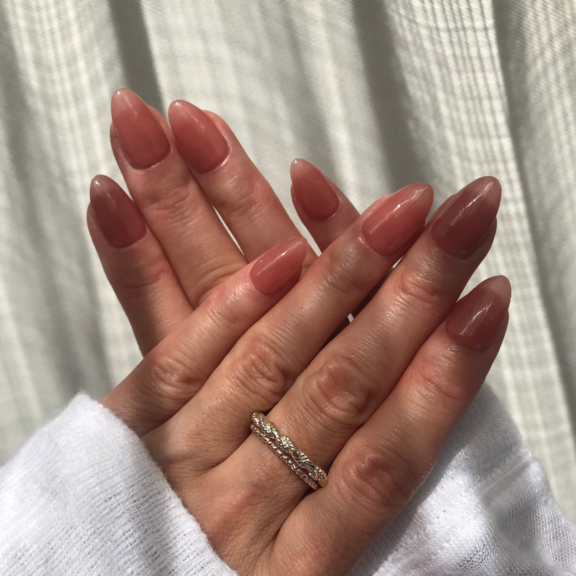 Soft, nude pink press-on nails in Almond shape. 