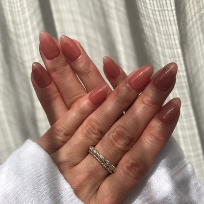 Soft, nude pink press-on nails in Almond shape. 