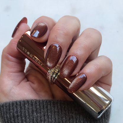 Calm Storm handmade glossy metallic bronze press-on nails in oval shape. 