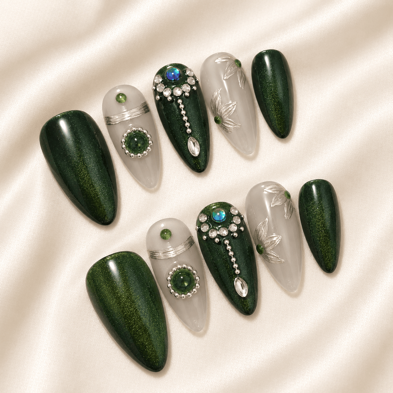 Calm Storm premium handmade press-on nails in emerald green featuring silver beads and floral design.