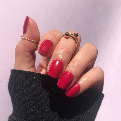 High gloss handmade press-on nails in hot pink in short square. 
