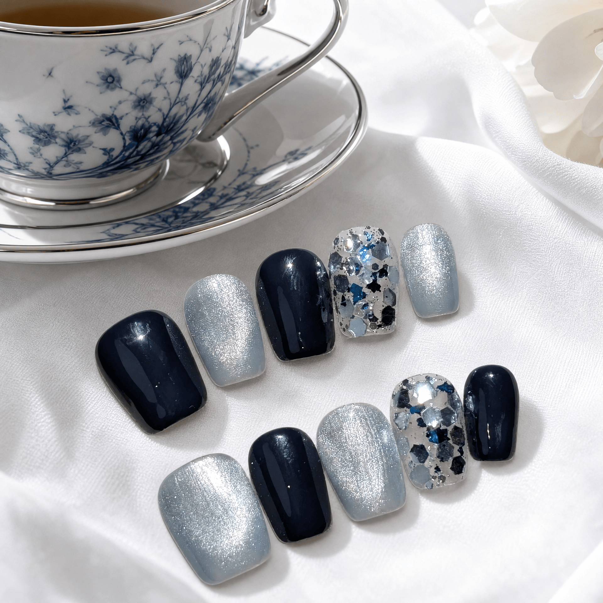 Calm Storm handmade press on nails in indigo and silver in short square. 