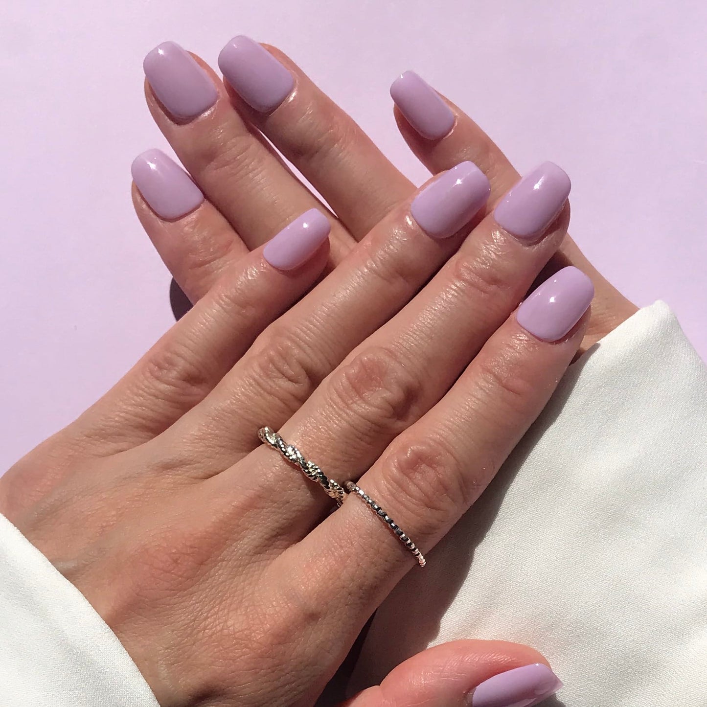 Calm Storm premium handmade press-on nails in lilac short square. 