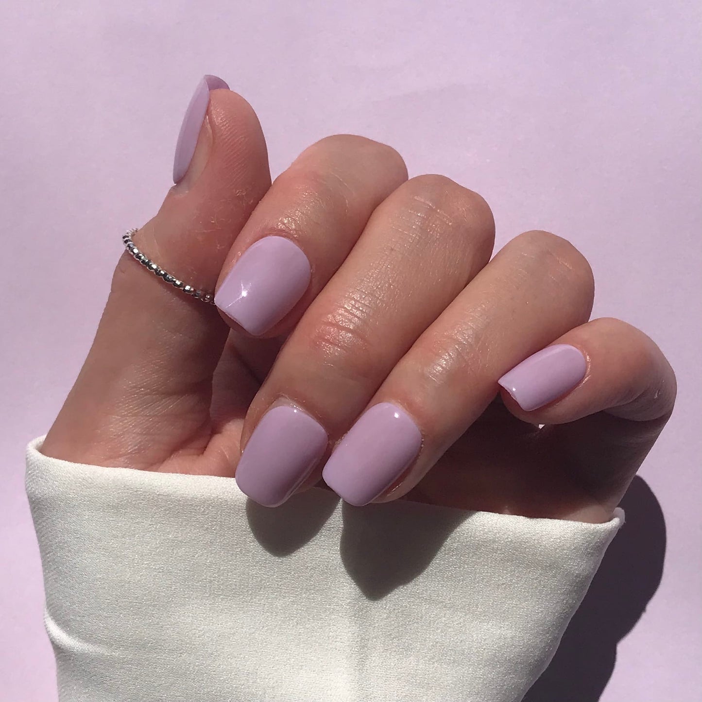 Handmade, salon quality high gloss press-on nails in lilac short square. 