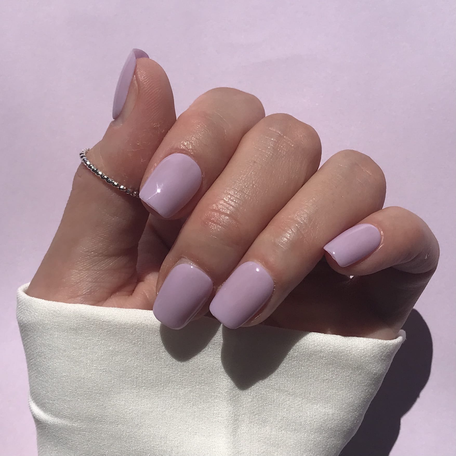 Handmade, salon quality high gloss press-on nails in lilac short square. 