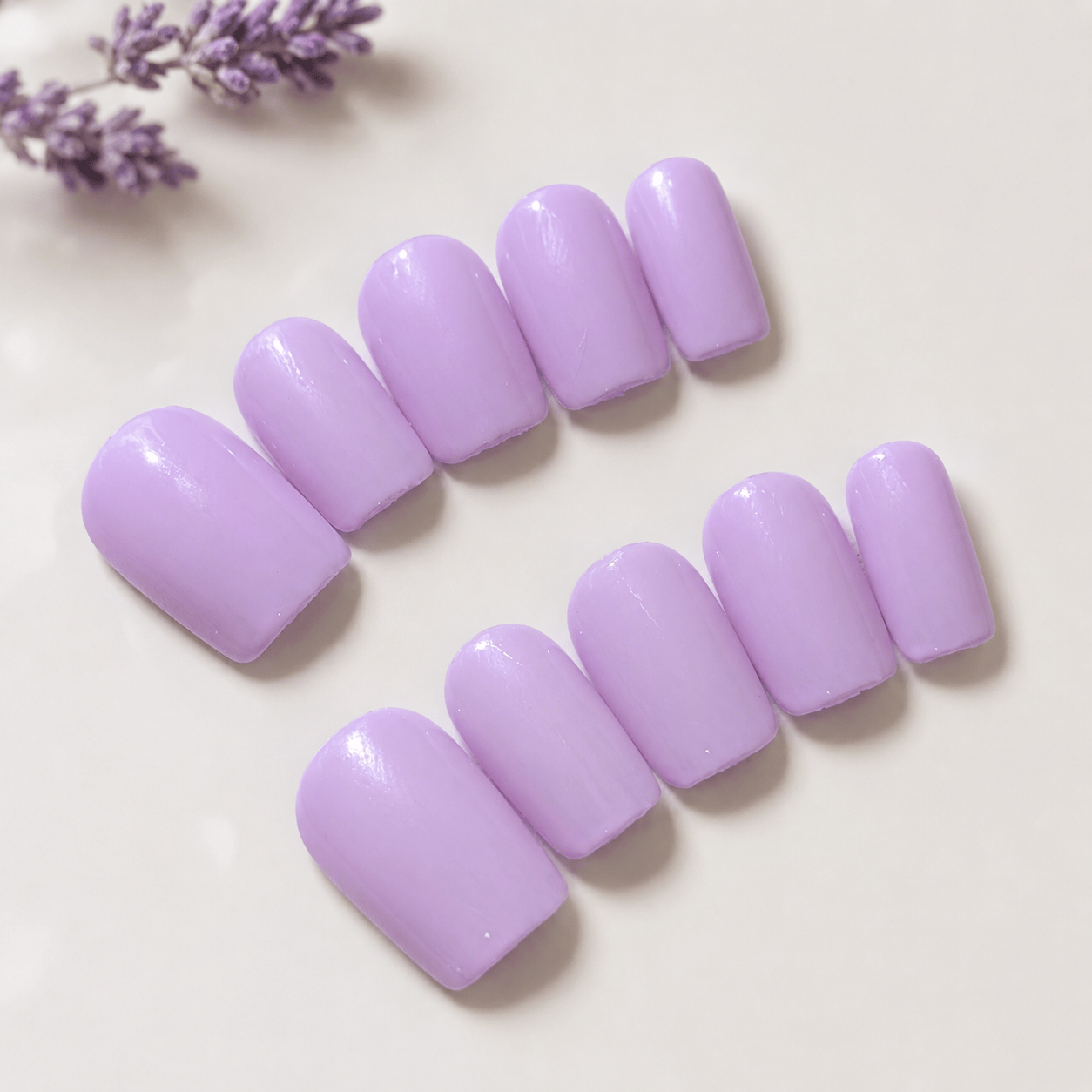 Calm Storm premium handmade nails in pastel lilac in square shape. 