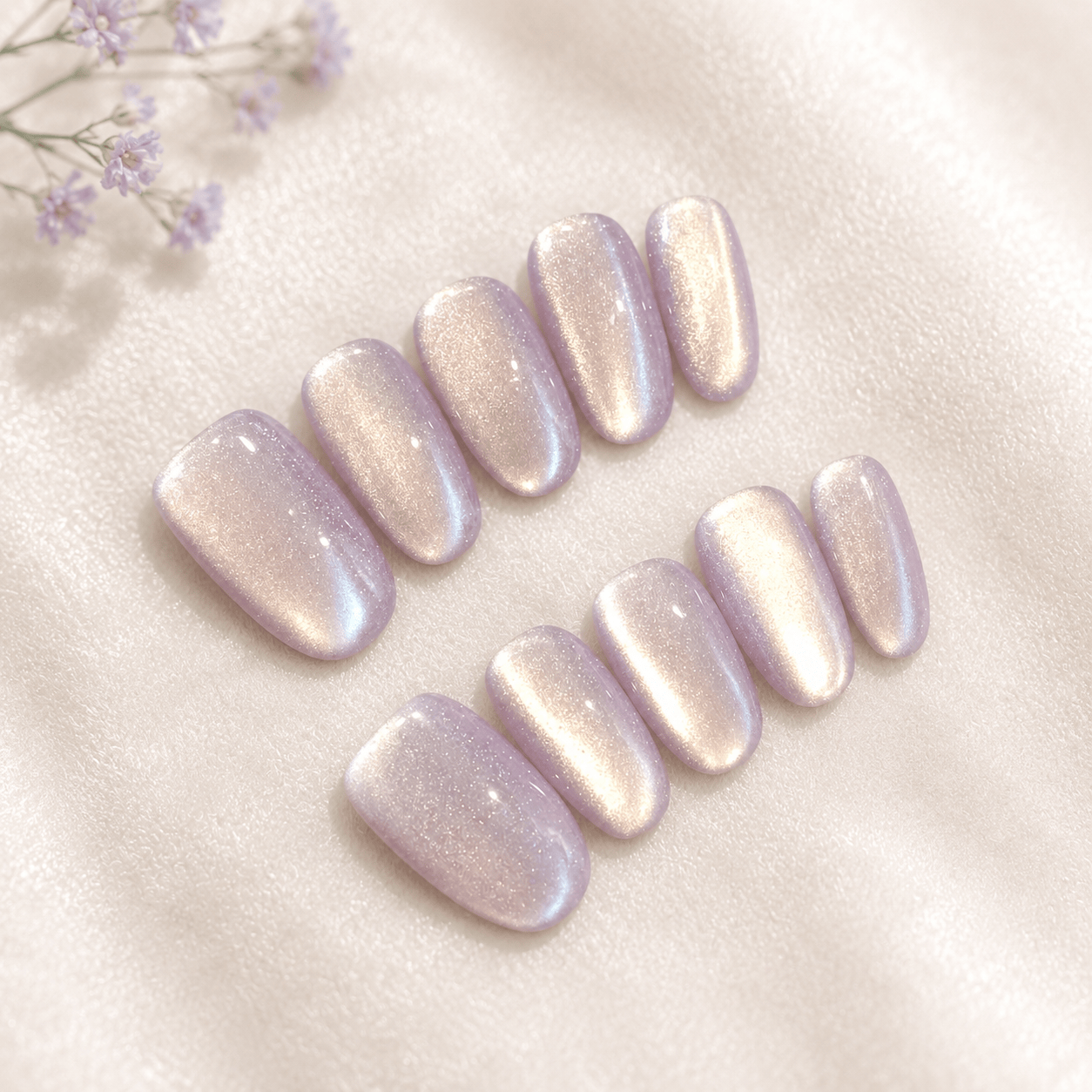 Calm Storm handmade press-on nails with a shimmering iridescent lavender-pink finish.