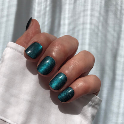 Premium handmade press-on nails in glittery teal in extra short. 