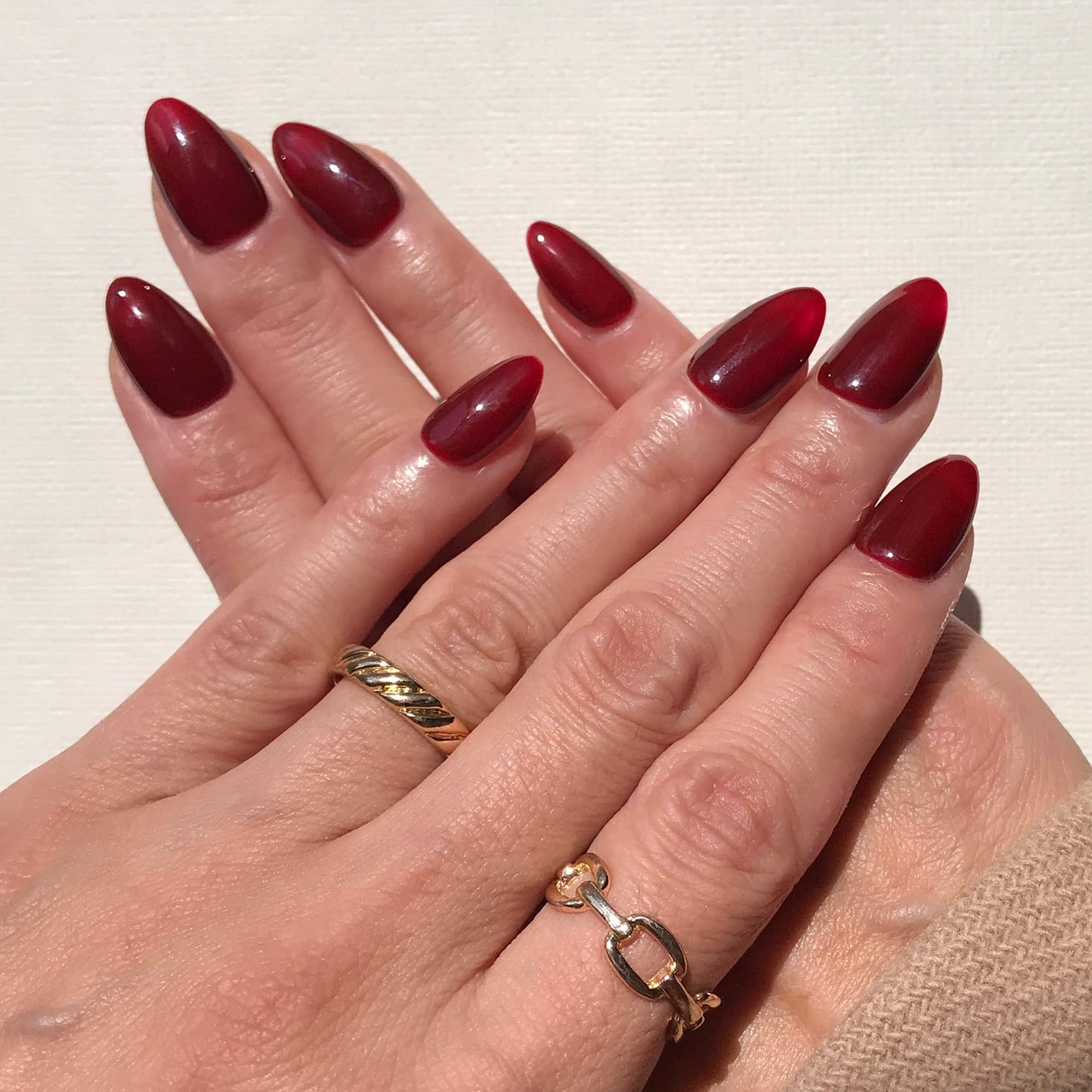 Salon finish high gloss dark red press-on nails.