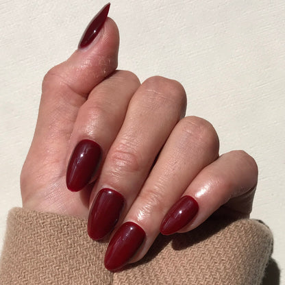 Calm Storm premium handmade press-on nails in ox blood in medium almond. 