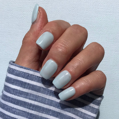 Handmade light blue press-on nails in short square. 