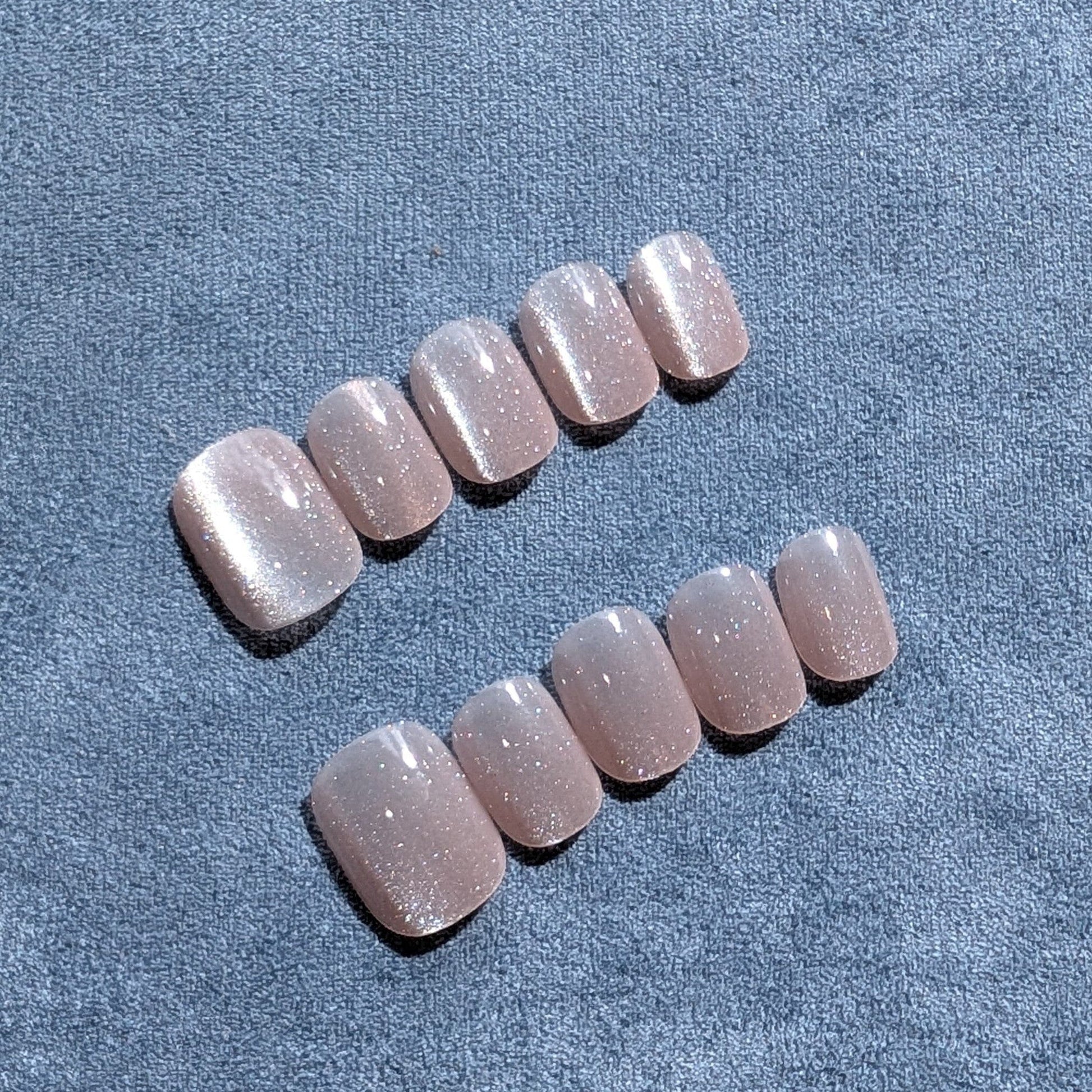 soft pink, handmade cat eye press-on nails in extra short.