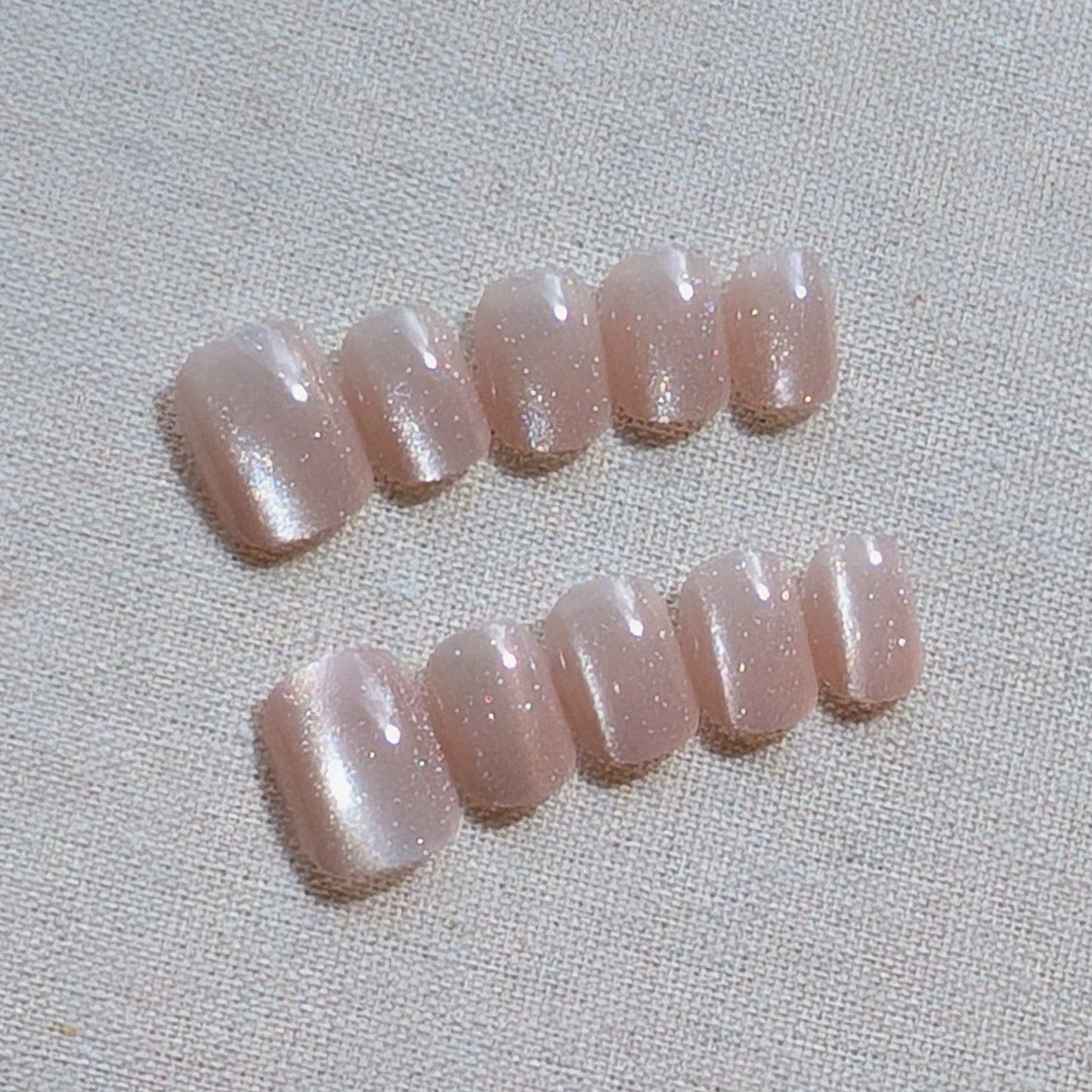 Calm Storm pale pink cat eye press-on nails in extra short