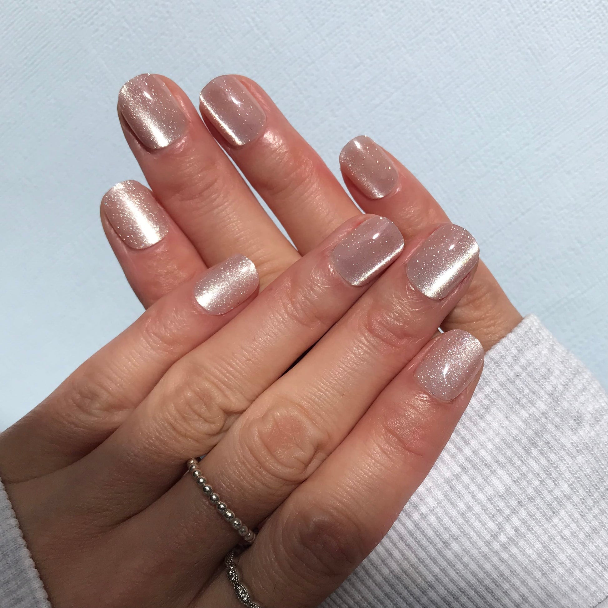 Calm Storm premium glittery pale pink press-on nails close up