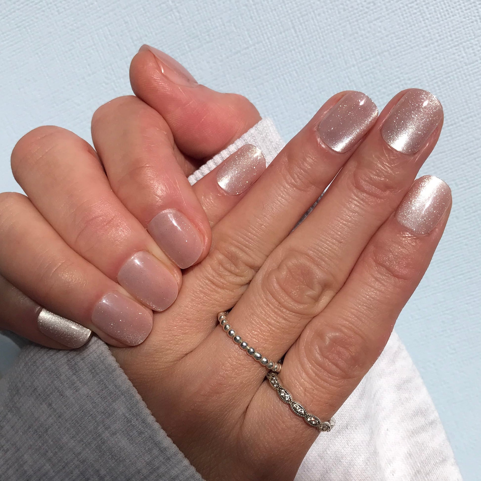 Salon quality press-on nails in pale pink cat eye in extra short.