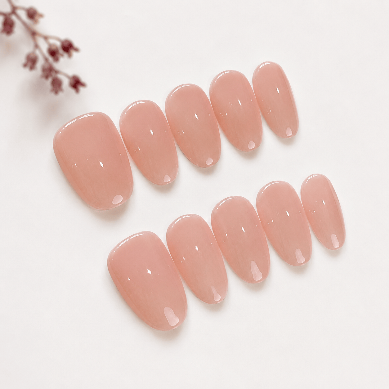 Calm Storm handmade press on nails in oatmeal pink nude in oval shape. 
