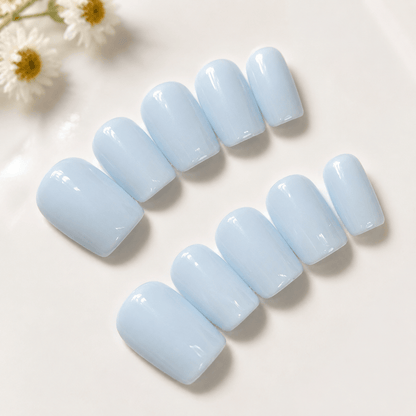 Calm Storm handmade press on nails in pastel blue in square shape.