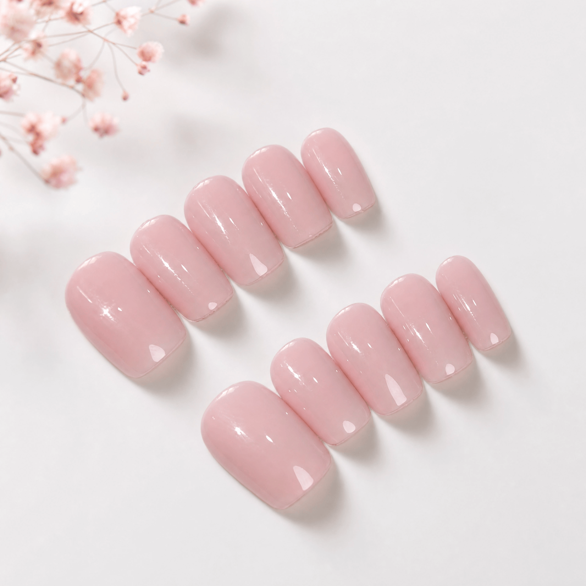 Calm Storm handmade press on nails in pastel pink in square shape. 