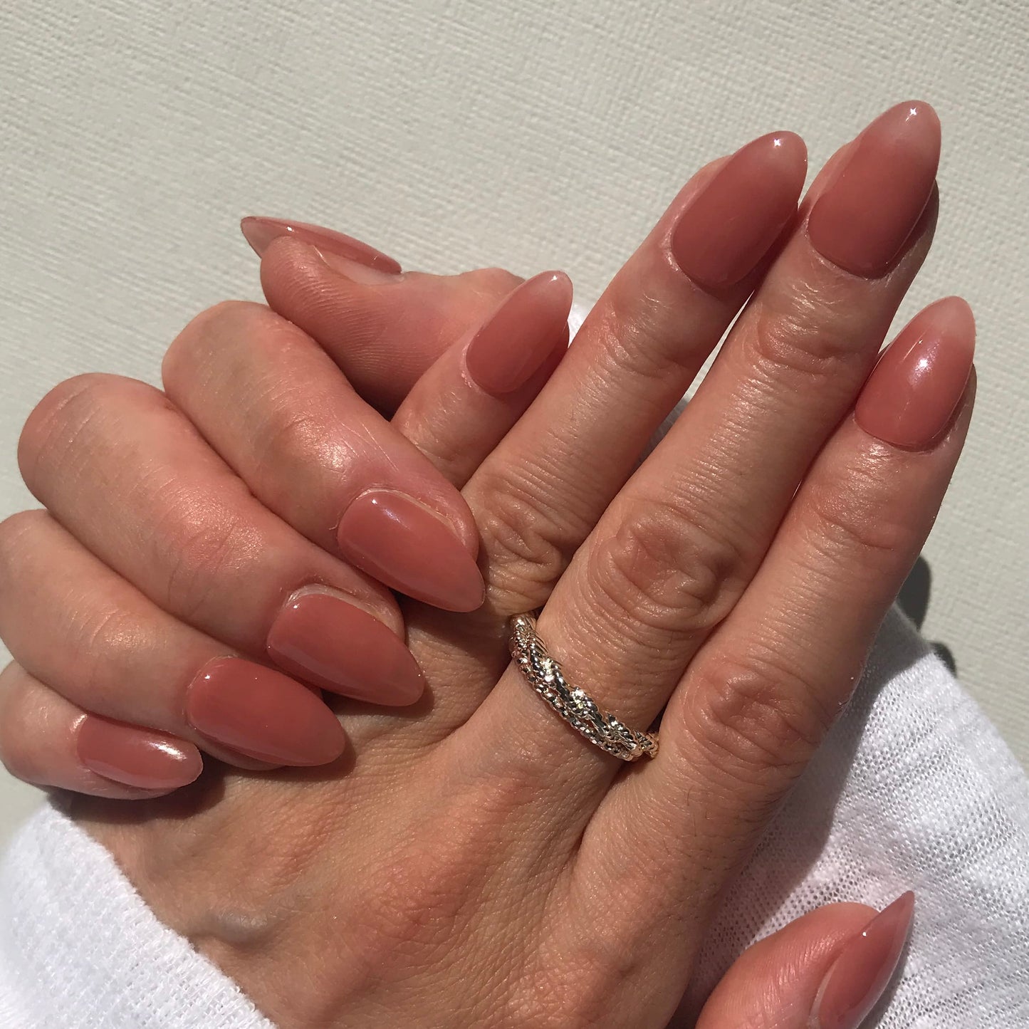 Handmade, salon finish press-on nails in high gloss pink nude. 