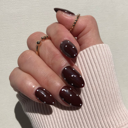 Handmade luxury brown press-on nails with white polka dot.