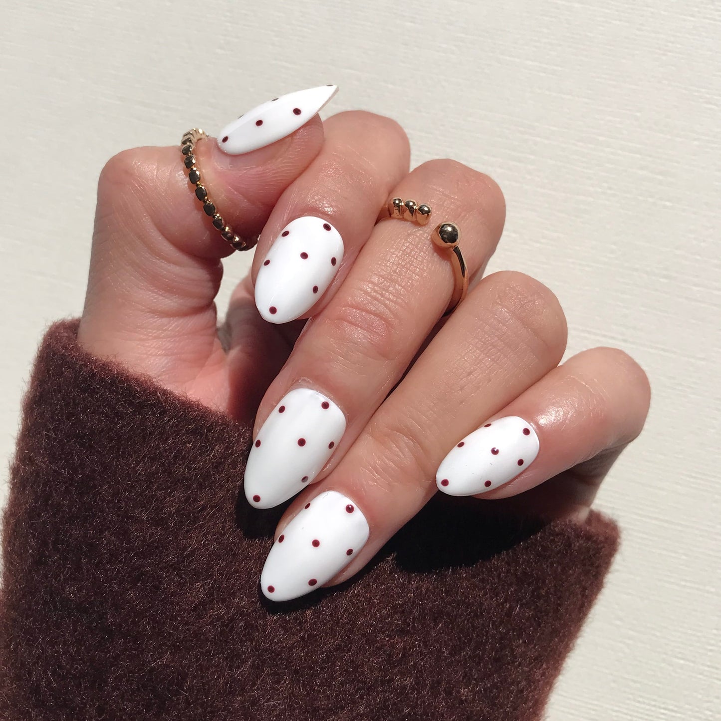 Handmade luxury white press-on nails with chocolate polka dot.