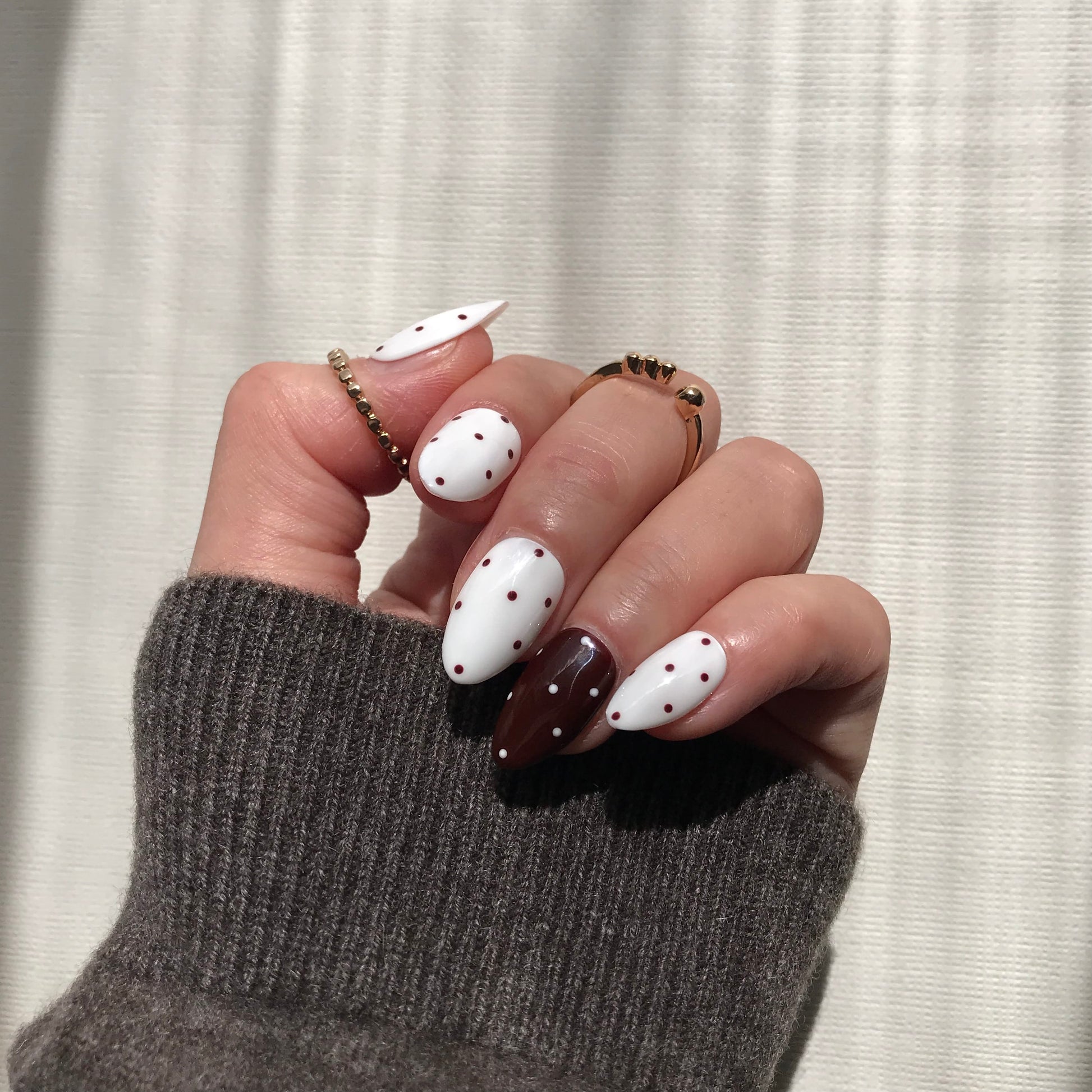 Handmade salon quality press-on nails with polka dot design.