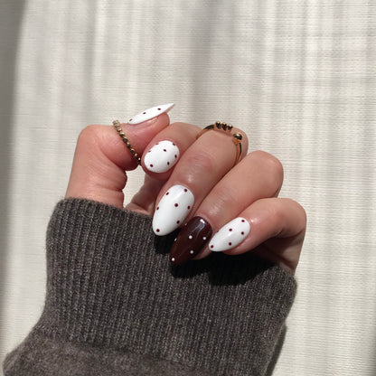 Handmade salon quality press-on nails with polka dot design.