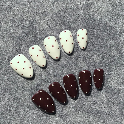Handmade salon quality press-on nails with polka dot design.