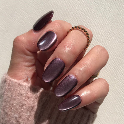Handmade metallic purple press-on in natural oval shape. 