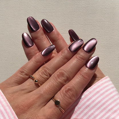 Premium handmade press-on nails in metallic purple in natural oval shape. 