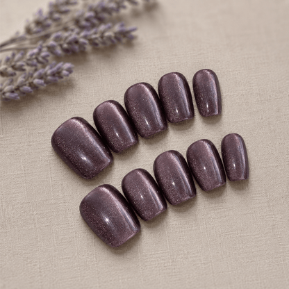 Calm Storm handmade purple press on nails with glittering cat eye design.