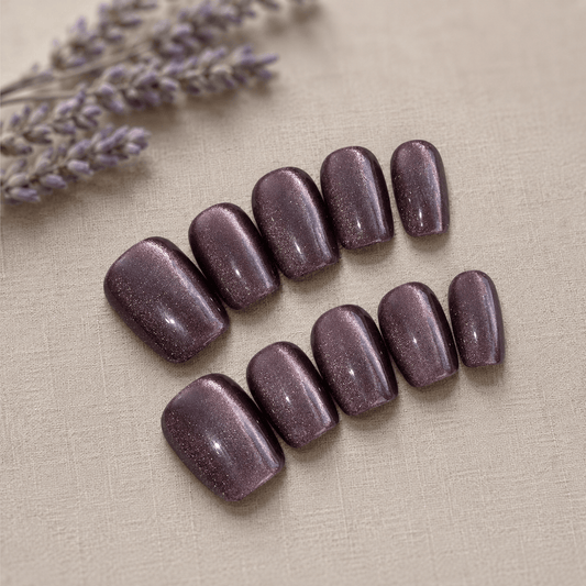 Calm Storm handmade purple press on nails with glittering cat eye design.