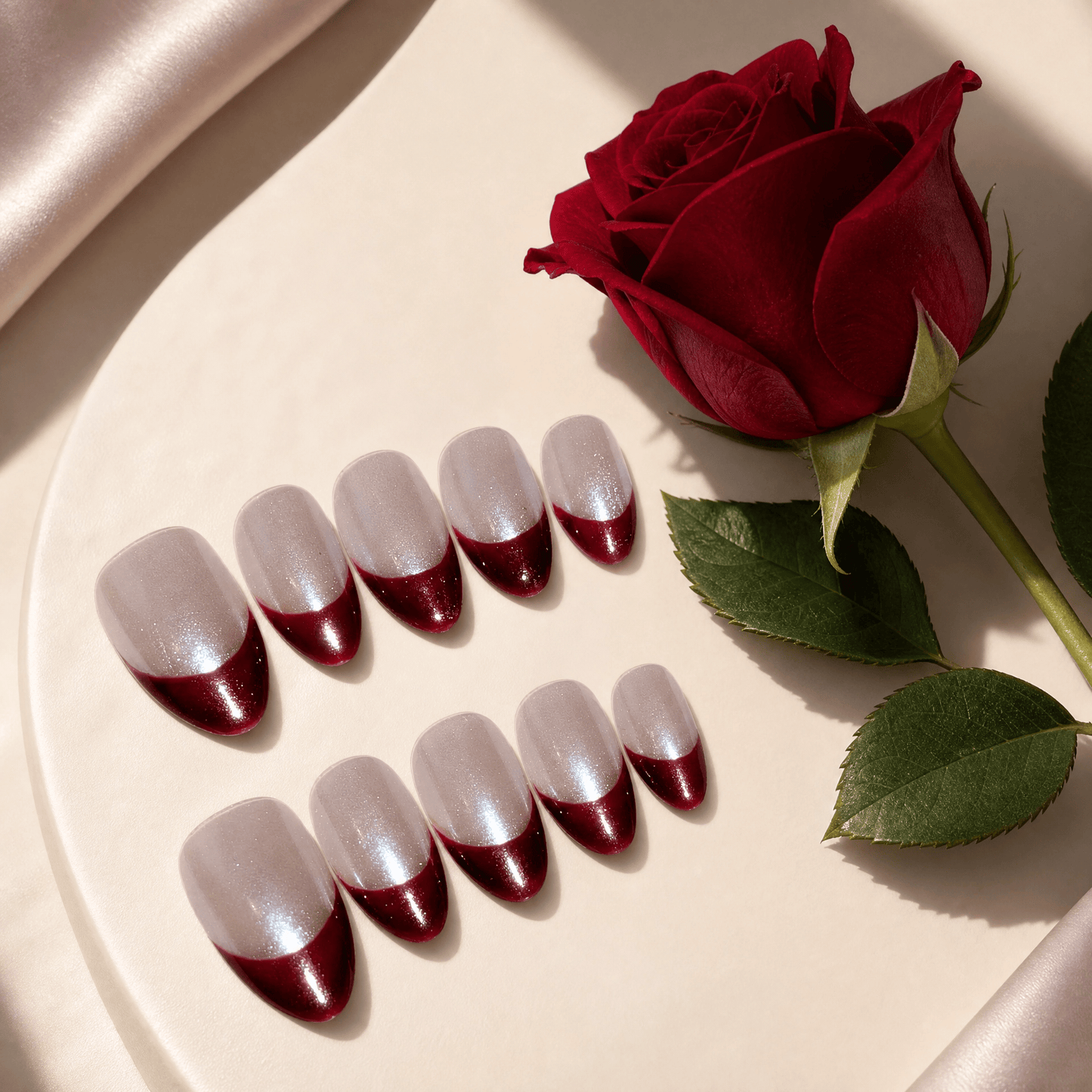 Calm Storm handmade French nails with red tip in short almond.  